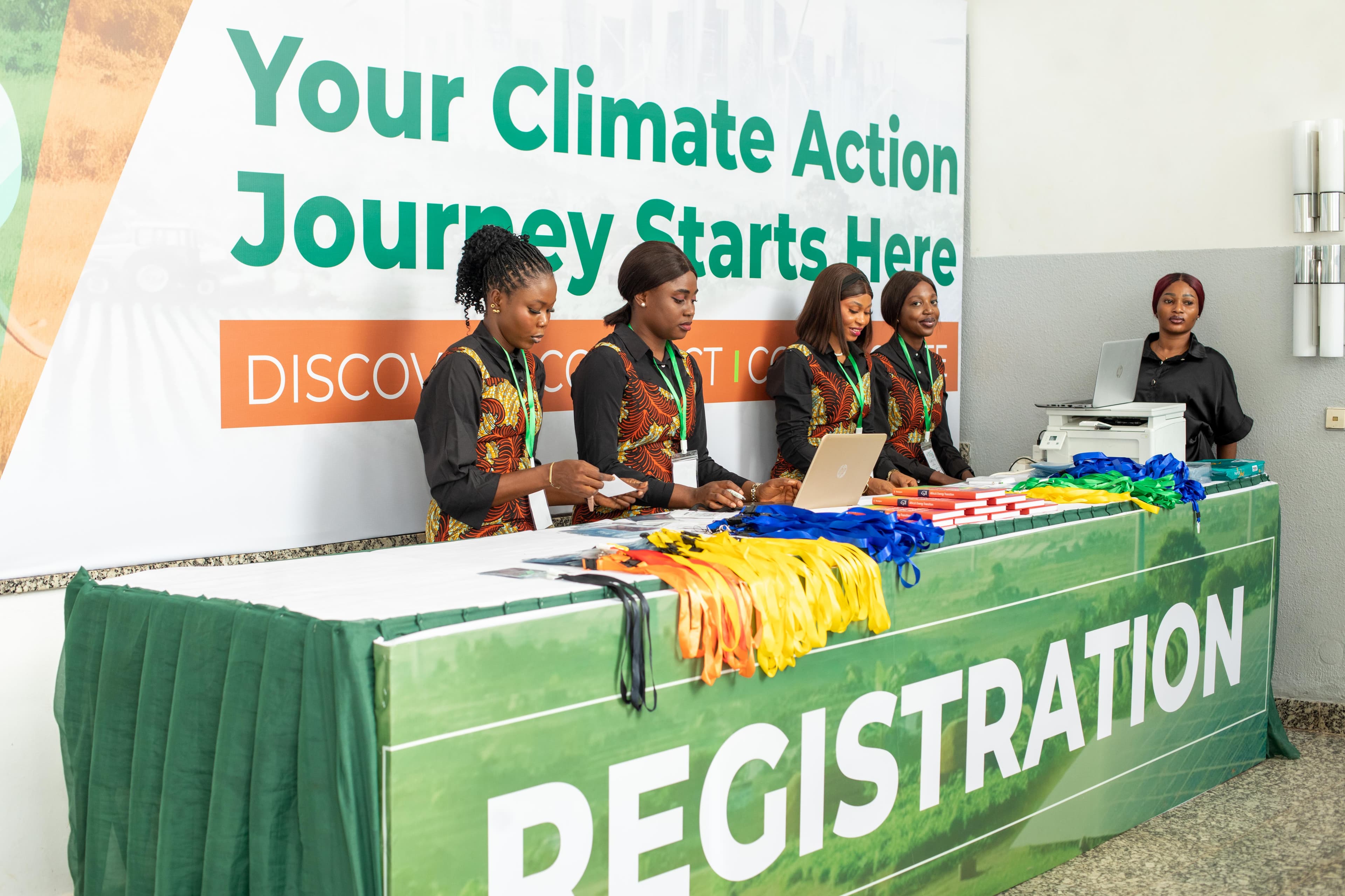 Women at the registration booth of a conference